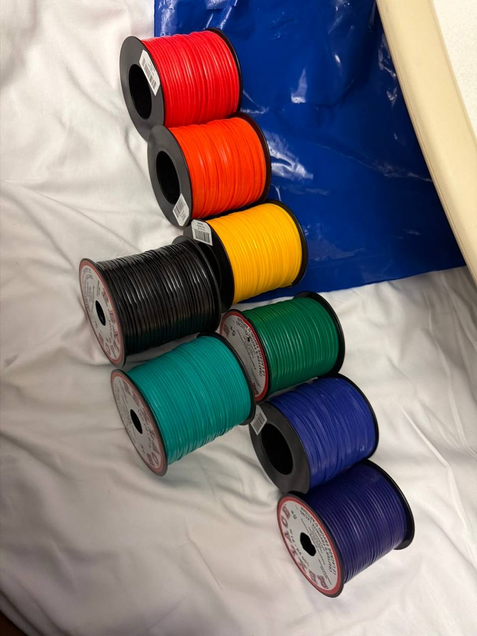 Spools of colorful GIMP plastic lace